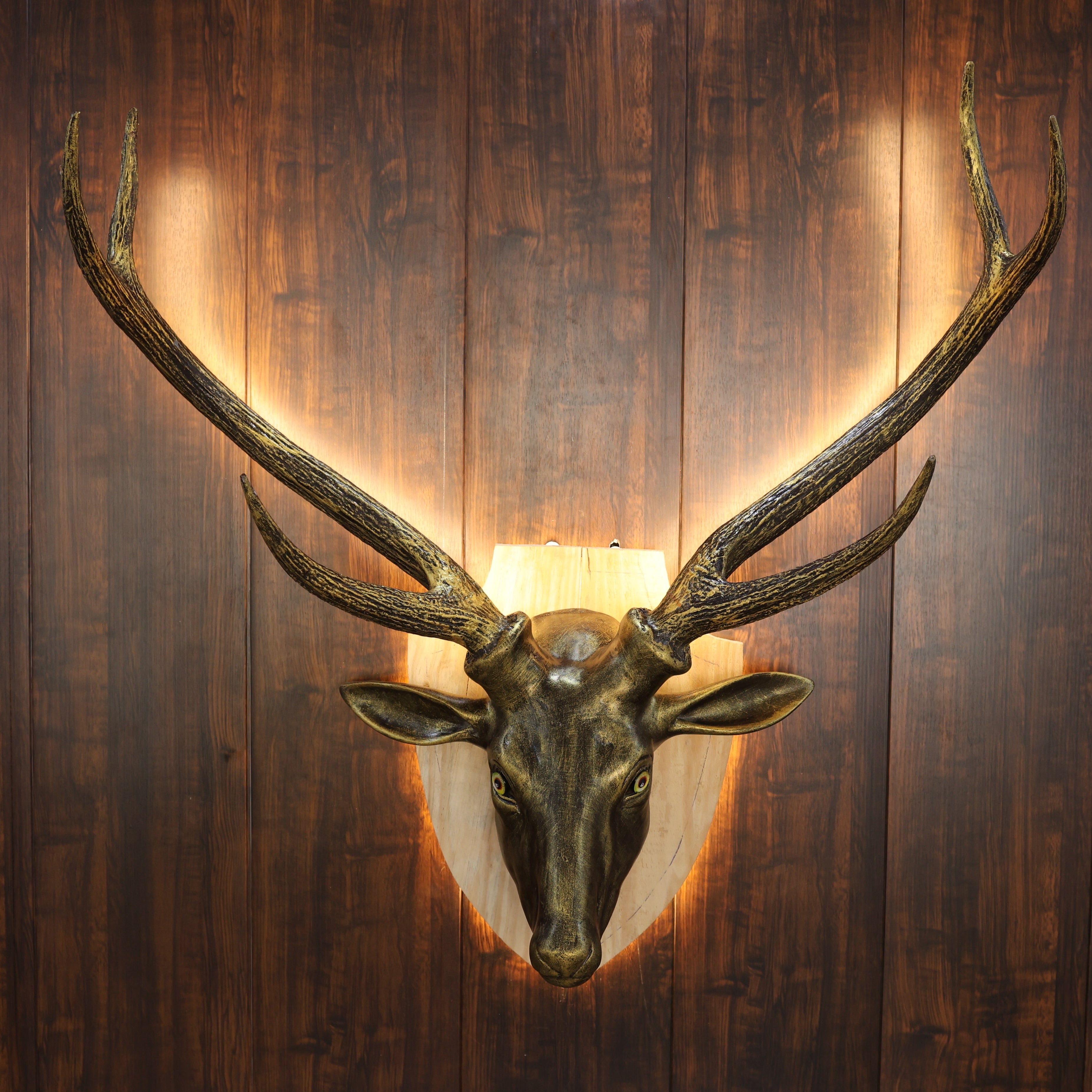 Decorative deer head mount on a wooden wall